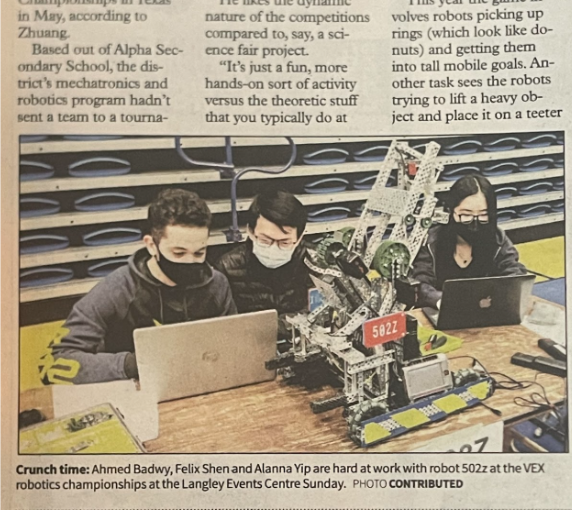 Newspaper clipping (VEX robotics team) — students with robot 502Z; competition prep.